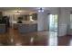 Open-concept kitchen and dining area with gray cabinets, stainless steel appliances, and sliding glass doors at 8551 Walden Trace Dr, Indianapolis, IN 46278