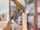 Unfinished basement with exposed beams, stored appliances, and a partially visible curio cabinet at 907 S Ohio St, Sheridan, IN 46069