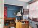 Bedroom with an entertainment system and a large television; closet with shelving at 907 S Ohio St, Sheridan, IN 46069