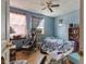 Modest bedroom features neutral walls, wood floors, and an AC unit at 907 S Ohio St, Sheridan, IN 46069