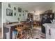Functional kitchen with dark cabinetry, a breakfast bar, and multiple picture frames on the wall at 907 S Ohio St, Sheridan, IN 46069