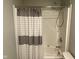 Bathroom featuring a shower with gray striped curtain and adjustable shower head at 9074 Larson Dr, Pendleton, IN 46064