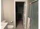 Bathroom with a shower stall, toilet, and an open door to a walk-in closet at 9074 Larson Dr, Pendleton, IN 46064