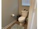 Powder room features toilet and a modern paper holder at 9074 Larson Dr, Pendleton, IN 46064