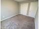 Bedroom featuring neutral colors, closet doors with wall to wall carpeting at 9074 Larson Dr, Pendleton, IN 46064