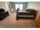 Comfortable bedroom with a bed, desk, tv stand, and shelving, creating a relaxing and functional space at 9074 Larson Dr, Pendleton, IN 46064