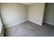 An empty bedroom features neutral-toned walls and carpeting at 9074 Larson Dr, Pendleton, IN 46064