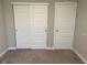 Bedroom featuring neutral colors and closet doors with wall to wall carpeting at 9074 Larson Dr, Pendleton, IN 46064