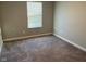 Bright bedroom with neutral colors and a large window with covering at 9074 Larson Dr, Pendleton, IN 46064