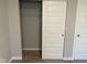 Neutral bedroom with wall to wall carpeting featuring an open closet at 9074 Larson Dr, Pendleton, IN 46064