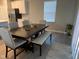 Open concept dining room featuring a wooden table with neutral colored chairs and a bench at 9074 Larson Dr, Pendleton, IN 46064