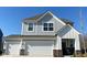 Close-up of the home's facade highlighting its architectural details and curb appeal at 9074 Larson Dr, Pendleton, IN 46064
