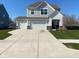 Beautiful two-story home with a three-car garage and well-maintained lawn at 9074 Larson Dr, Pendleton, IN 46064