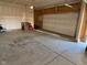 A spacious two car garage with ample room for parking and storage, perfect for a modern Gathering at 9074 Larson Dr, Pendleton, IN 46064