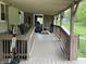 Exterior porch featuring wooden decking and railings with entry into the house at 9510 N Cooney Rd, Mooresville, IN 46158