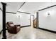 Spacious basement featuring neutral walls and a comfortable recliner at 9510 N Cooney Rd, Mooresville, IN 46158
