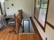 View of a basement door, window and wood railing at 9510 N Cooney Rd, Mooresville, IN 46158
