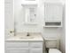 Bright bathroom with a white sink, toilet and cabinets at 9510 N Cooney Rd, Mooresville, IN 46158