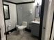 Neutral-toned bathroom featuring a toilet, vanity with mirror, and modern fixtures at 9510 N Cooney Rd, Mooresville, IN 46158