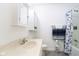 A well-maintained bathroom featuring a vanity, toilet, and a shower-tub combination with storage at 9510 N Cooney Rd, Mooresville, IN 46158