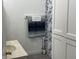 Small bathroom with a towel rack, decorative shower curtain, and built-in cabinet at 9510 N Cooney Rd, Mooresville, IN 46158