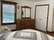 Well-lit bedroom featuring dresser, window, and comfortable decor at 9510 N Cooney Rd, Mooresville, IN 46158