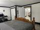 Bedroom with a view of an entrance to a hallway, including storage and a computer set up at 9510 N Cooney Rd, Mooresville, IN 46158