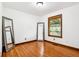 A bright bedroom featuring hardwood floors and natural light at 9510 N Cooney Rd, Mooresville, IN 46158