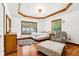 Sunlit bedroom with hardwood floors, comfortable seating, a dresser, and a serene atmosphere at 9510 N Cooney Rd, Mooresville, IN 46158