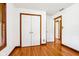 A well-lit bedroom offering ample closet space with hardwood floors and neutral wall paint at 9510 N Cooney Rd, Mooresville, IN 46158