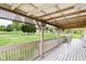 Relaxing covered porch with wood flooring and railing that offers a lovely outdoor living space at 9510 N Cooney Rd, Mooresville, IN 46158