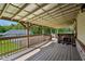 A covered wood deck features open beams and railing at 9510 N Cooney Rd, Mooresville, IN 46158