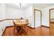 Dining room with hardwood floors and white walls with wood trim at 9510 N Cooney Rd, Mooresville, IN 46158