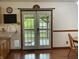 View of dining room showing French doors to back deck with dog door at 9510 N Cooney Rd, Mooresville, IN 46158