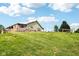 This property has green grass, light siding, white trim and is set on a hill at 9510 N Cooney Rd, Mooresville, IN 46158