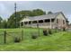 Lovely home with a large front yard, partial brick facade and a cozy covered porch at 9510 N Cooney Rd, Mooresville, IN 46158