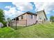 Exterior of the home, featuring an attached deck and fenced yard at 9510 N Cooney Rd, Mooresville, IN 46158