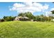 A cozy single-story home is perfectly nestled on a vast green lawn with mature trees enhancing the natural beauty at 9510 N Cooney Rd, Mooresville, IN 46158