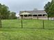Charming ranch-style home with a welcoming front porch and well-maintained lawn at 9510 N Cooney Rd, Mooresville, IN 46158