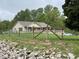 Well-maintained home with fenced yard and a spacious lawn, perfect for outdoor activities at 9510 N Cooney Rd, Mooresville, IN 46158