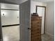Hallway view with decorative wood dresser and entry to the adjacent rooms at 9510 N Cooney Rd, Mooresville, IN 46158