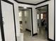 Hallway with white paneled doors leading to various areas of the home at 9510 N Cooney Rd, Mooresville, IN 46158