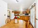 Bright eat-in kitchen showing natural wood cabinets, stainless appliances at 9510 N Cooney Rd, Mooresville, IN 46158