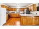 Kitchen featuring wood cabinets, stainless steel appliances, and breakfast bar at 9510 N Cooney Rd, Mooresville, IN 46158