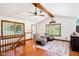 Inviting living room with vaulted ceilings, hardwood floors, and ample natural light at 9510 N Cooney Rd, Mooresville, IN 46158