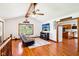Open living room boasts hardwood floors, high ceilings, and access to the kitchen, perfect for modern living at 9510 N Cooney Rd, Mooresville, IN 46158