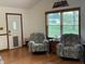 Inviting living room with hardwood flooring, natural light, and comfortable seating at 9510 N Cooney Rd, Mooresville, IN 46158