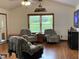Cozy living room featuring vaulted ceilings, natural light and comfortable seating at 9510 N Cooney Rd, Mooresville, IN 46158