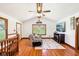 Bright and airy living room features hardwood floors, large windows, and a cozy seating area at 9510 N Cooney Rd, Mooresville, IN 46158