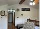 Bright loft featuring hardwood floors, high ceilings, and a view of the stairway at 9510 N Cooney Rd, Mooresville, IN 46158